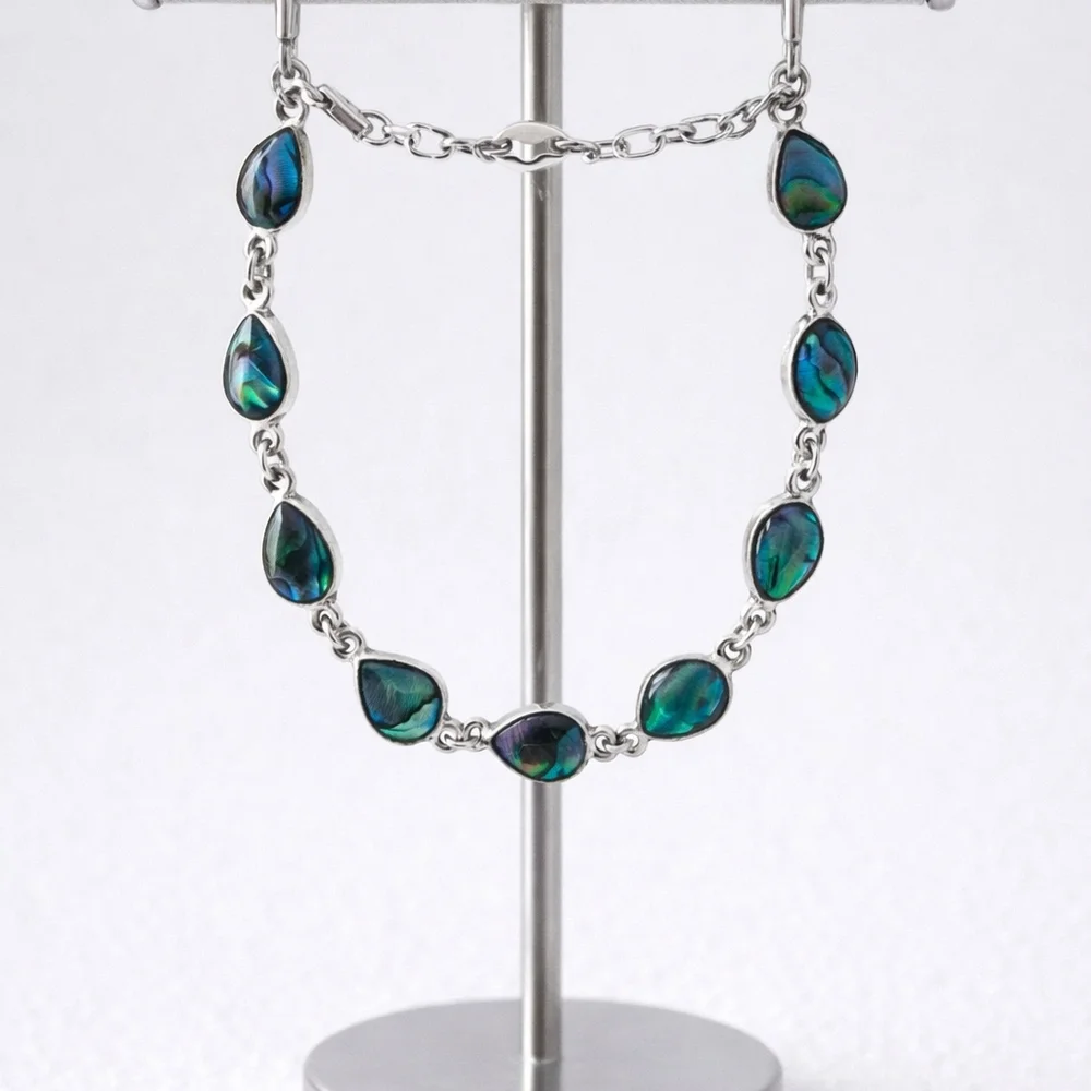 Silver link bracelet with teardrop-shaped abalone. - Picture 2 of 3